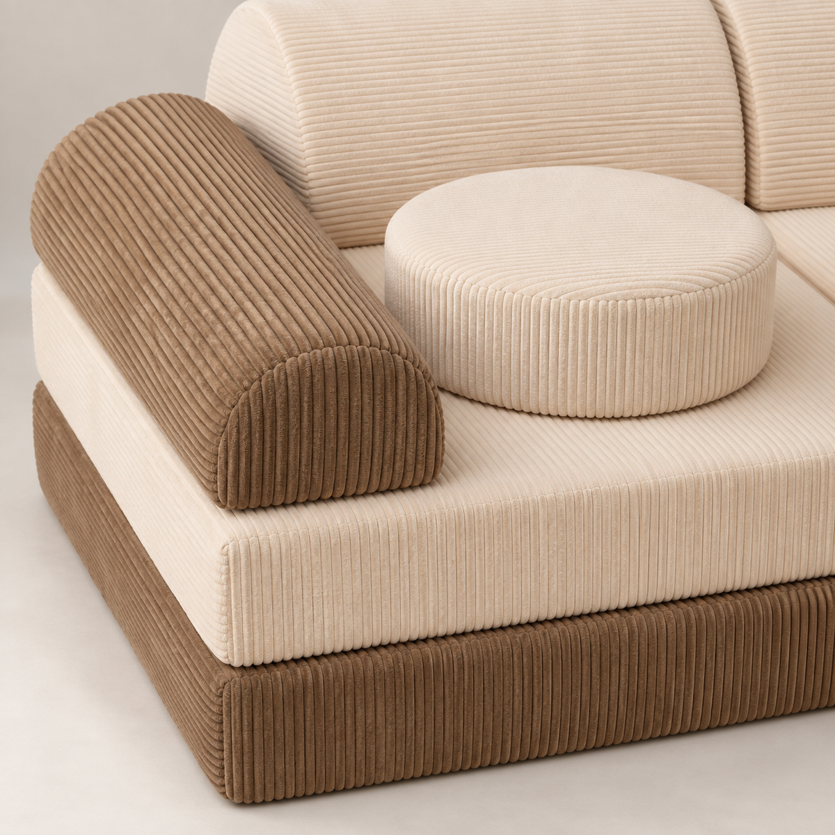 Loaf assembled as a sofa: Sand corduroy bases, Cream seats and backrests, Sand armrests and two round Cream cushions